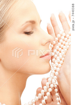 beautiful woman with pearl beads 7440388
