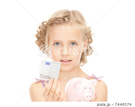 little girl with piggy bank and money little girl with piggy bank and money 7440574