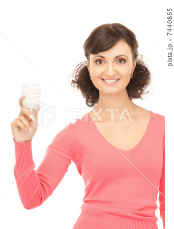 woman holding energy saving bulb 7440865