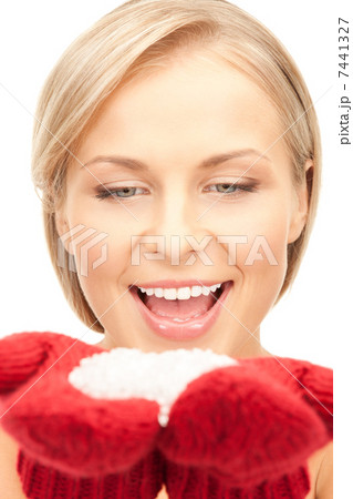 beautiful woman in red mittens with snow 7441327
