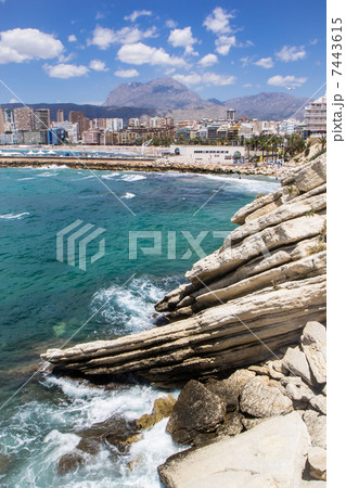 Hotels and beach of Benidorm. Sky and sea. 7443615
