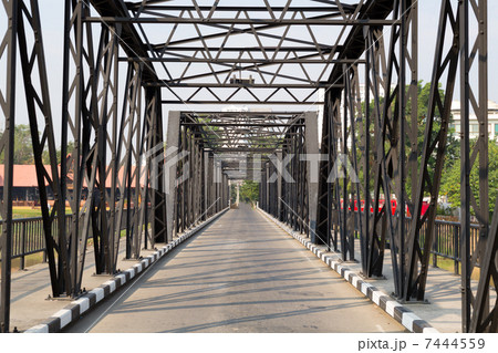 Road through metal bridge tunnel Road through metal bridge tunnel 7444559