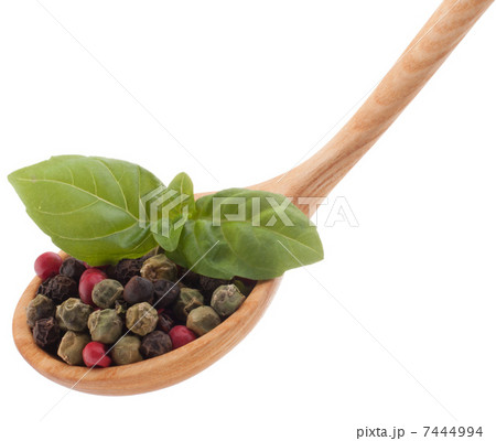 Pepper seasoning mix in wooden spoon isolated on white backgrou Pepper seasoning mix in wooden spoon isolated on white backgrou 7444994