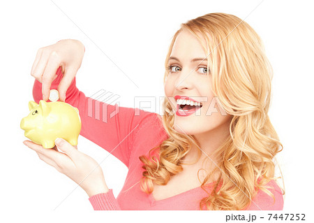 lovely woman with piggy bank and money 7447252
