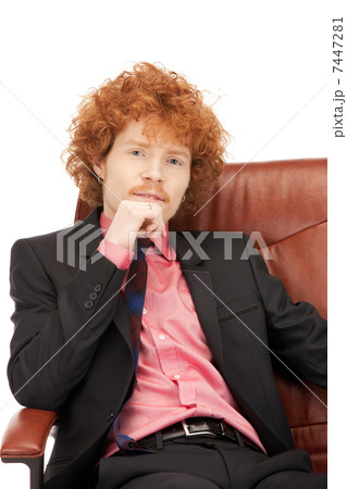 young businessman sitting in chair 7447281