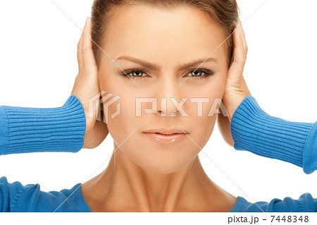 woman with hands on ears woman with hands on ears 7448348