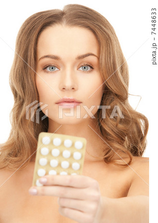 young beautiful woman with pills 7448633