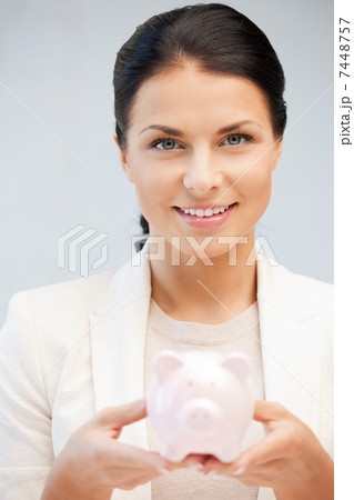 lovely woman with piggy bank 7448757