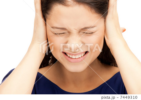 woman with hands on ears 7449310