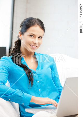 happy woman with laptop computer 7449697