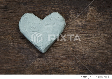 clay heart on wooden surface 7460761