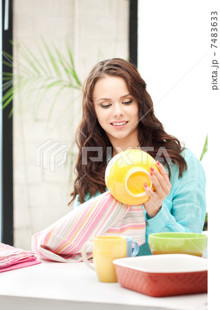lovely housewife at the kitchen lovely housewife at the kitchen 7483633