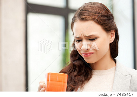 lovely businesswoman with mug 7485417