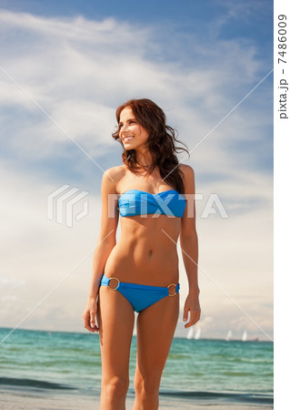 happy smiling woman on the beach 7486009