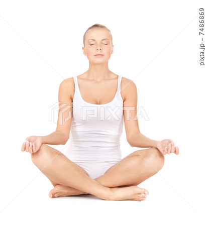 woman practicing yoga lotus pose woman practicing yoga lotus pose 7486869