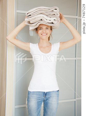 smiling teenage girl with towels smiling teenage girl with towels 7487129
