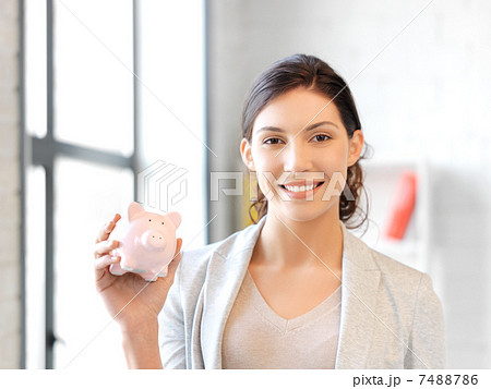 lovely woman with piggy bank 7488786
