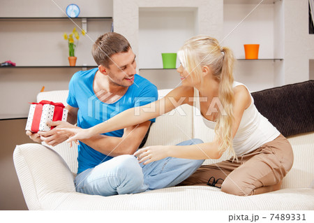 happy romantic couple with gift happy romantic couple with gift 7489331