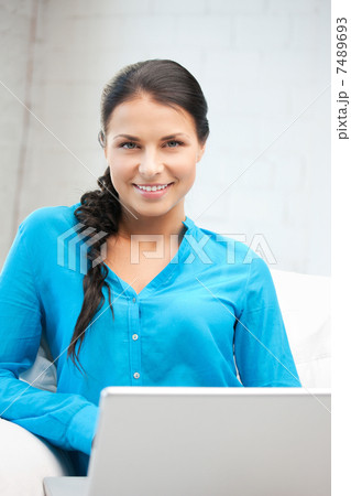 happy woman with laptop computer 7489693