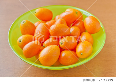 Fresh ripe Kumquats in a bowl Fresh ripe Kumquats in a bowl 7493349
