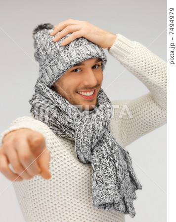 man in winter clothes pointing his finger 7494979