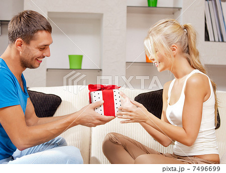 happy romantic couple with gift 7496699