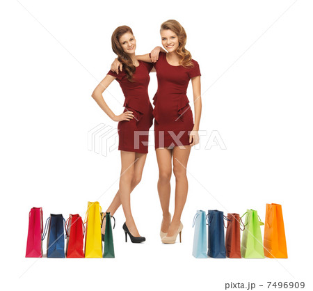 teenage girls in red dresses with shopping bags teenage girls in red dresses with shopping bags 7496909