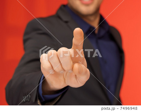 handsome man in suit pressing virtual button handsome man in suit pressing virtual button 7496948