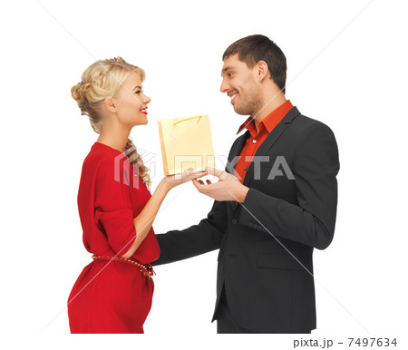 man and woman with present man and woman with present 7497634