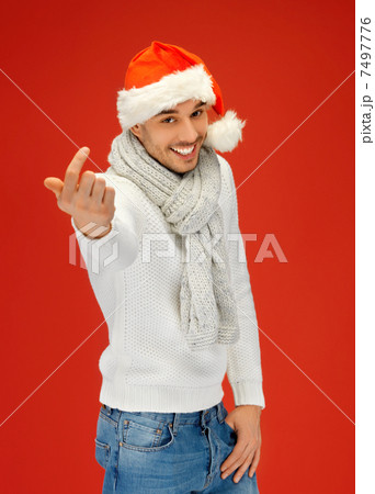 handsome man in christmas hat handsome man in christmas hat 7497776