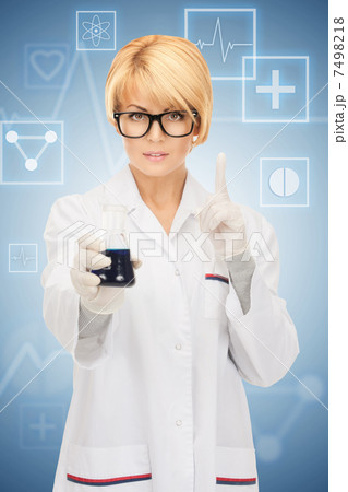 lab worker holding up test tube 7498218