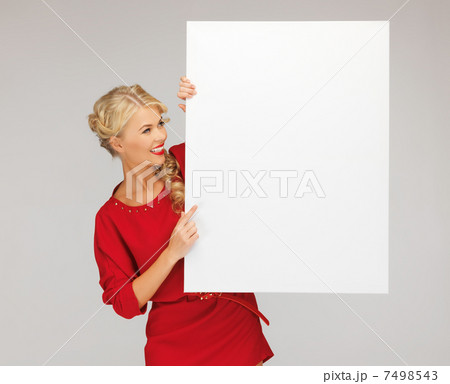 lovely woman in red dress with blank board 7498543