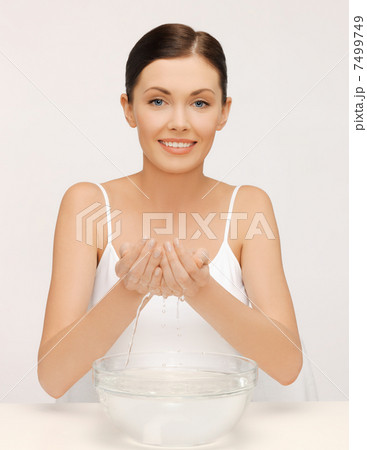 woman washing her face woman washing her face 7499749