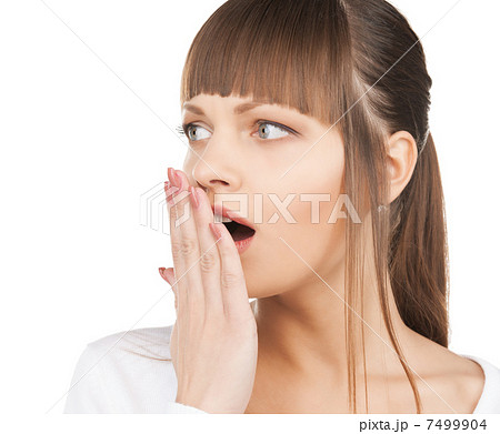 woman with hand over mouth 7499904
