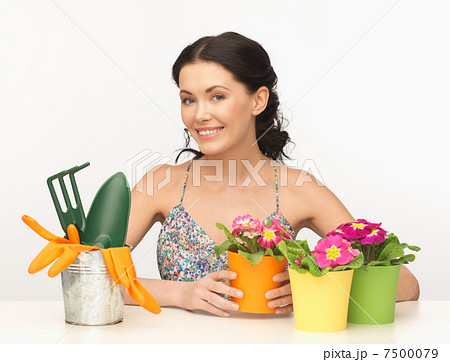 housewife with flower in pot and gardening set 7500079