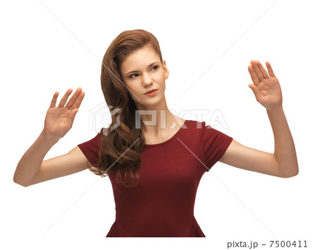 girl in red dress working with something imaginary 7500411
