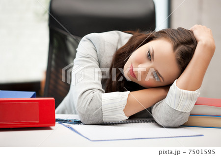 bored and tired woman behid the table bored and tired woman behid the table 7501595