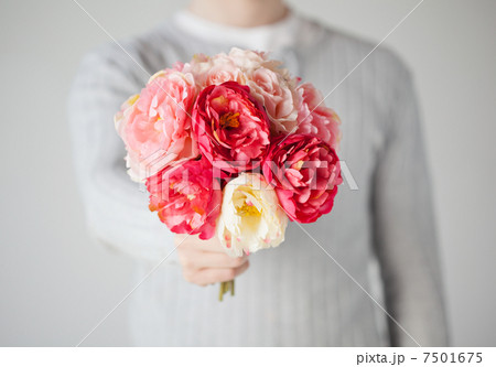man giving bouquet of flowers man giving bouquet of flowers 7501675
