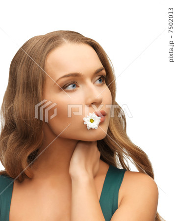 woman with camomile in mouth 7502013