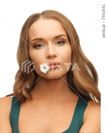 woman with camomile in mouth woman with camomile in mouth 7502031