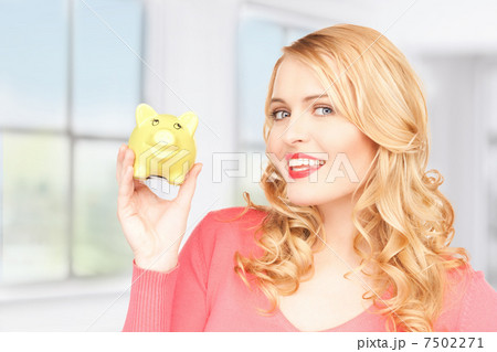 lovely woman with piggy bank 7502271