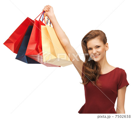 teenage girl in red dress with shopping bags teenage girl in red dress with shopping bags 7502638