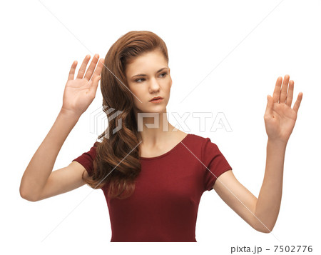 teenage girl working with something imaginary 7502776