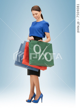 woman carrying shopping bags woman carrying shopping bags 7504081