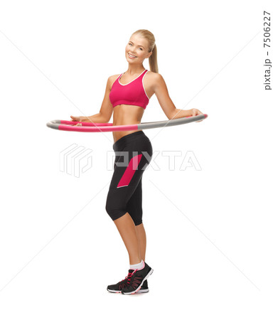 young sporty woman with hula hoop young sporty woman with hula hoop 7506227
