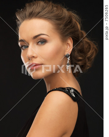 woman with diamond earrings woman with diamond earrings 7506265