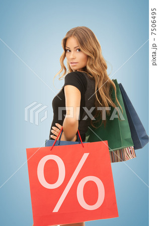 woman with shopping bags 7506495