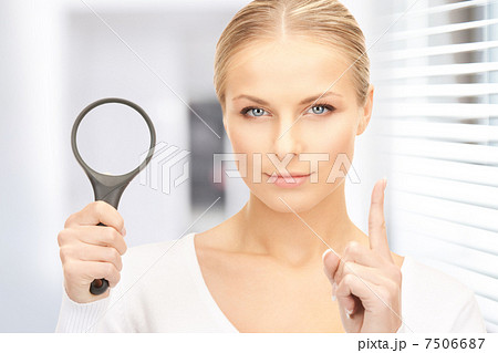 woman with magnifying glass woman with magnifying glass 7506687