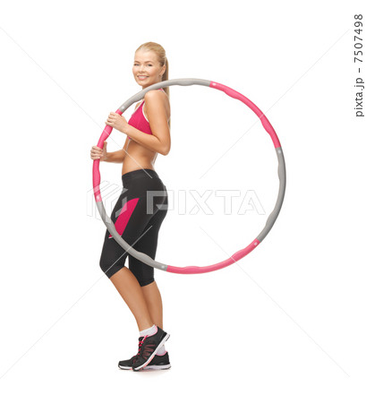 young sporty woman with hula hoop young sporty woman with hula hoop 7507498
