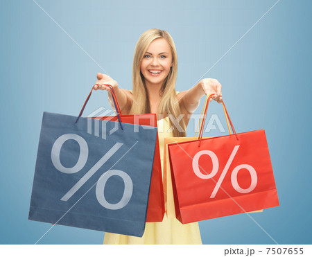 woman holding shopping bags with percent sign 7507655